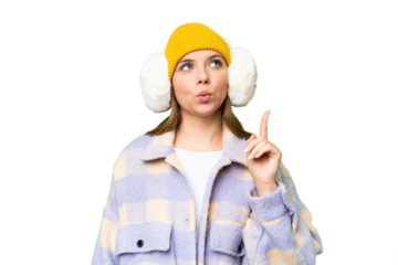 Young blonde woman wearing winter muffs over isolated chroma key background thinking an idea pointing the finger up