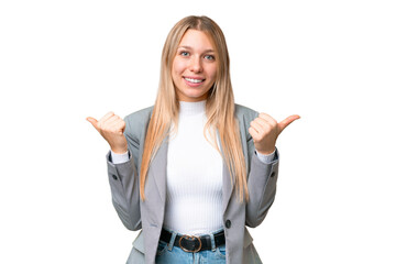 Young pretty blonde woman over isolated chroma key background with thumbs up gesture and smiling