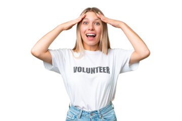 Young volunteer woman over isolated chroma key background with surprise expression