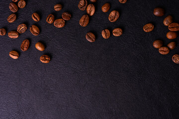 The A coffee bean on black leather surface with mockup space
