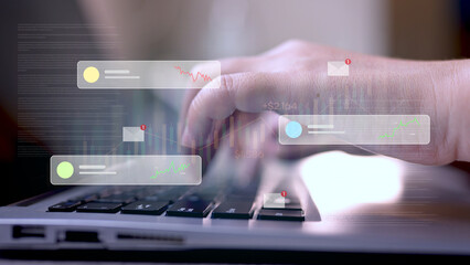 Hand Typing on Laptop Keyboard with Overlaid Virtual Financial Charts and Real-Time Data Analysis Interface.