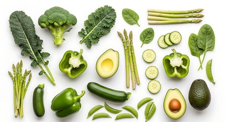 Assortment of fresh green vegetables including broccoli avocado bell peppers zucchini asparagus kale spinach and cucumber slices arranged on a white background