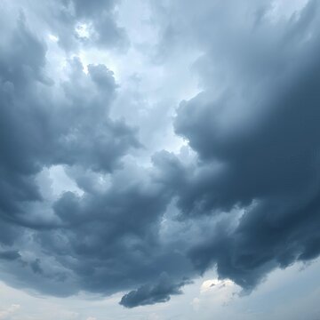 Panorama of dense, thick storm clouds in a dramatic overcast sky, heralding the rainy season,  season,  prelude