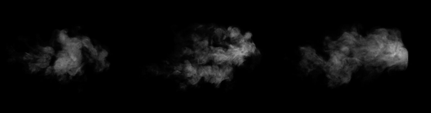 Close-up photo of abstract white steam or smoke. Illustration showing different textures and densities of white steam or smoke, isolated on black background.