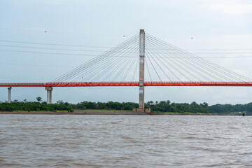 Obraz premium Nanay Bridge Iquitos Peru over Amazon River with Rainbow