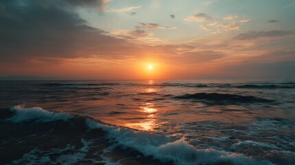 Serene Ocean Waves at Sunset with Warm Golden Sky

