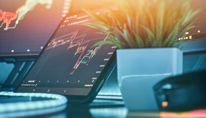 Bullish stock market chart on digital tablet