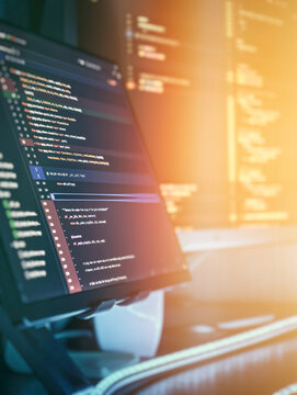 Modern programming workspace with glowing code display