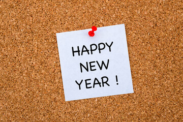 Happy New Year Note Pinned on Cork Board