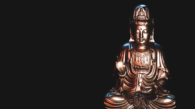 Golden buddha statue radiating serenity and peace on a black background