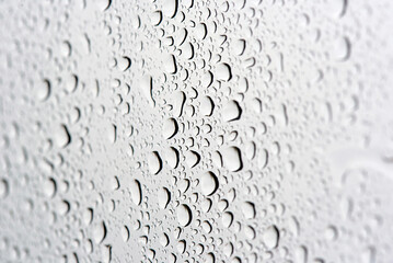 Beautifully detailed view of moisture droplets on smooth and clean surface with transparent textures and calm visual rhythm after light rain