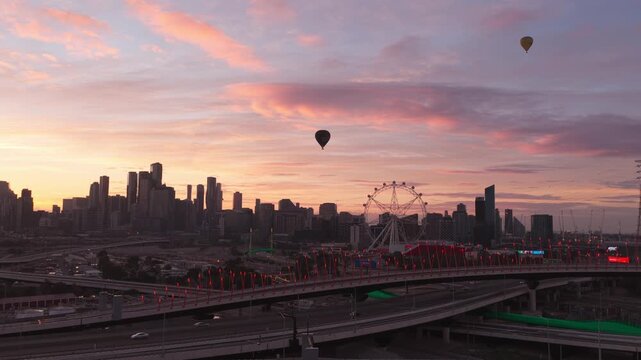 Aerial View of Melbourne Skyline with Hot Air Balloons at Sunrise