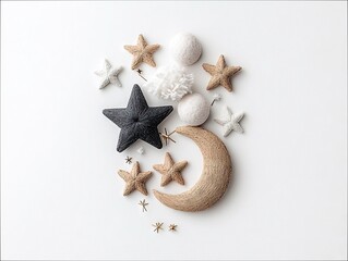 A collection of handmade celestial ornaments including stars, a crescent moon, and pom-poms, arranged artfully on a clean white background. The lighting is soft