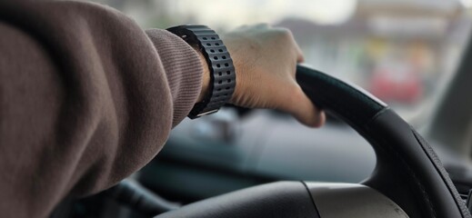 Hand on Wheel with Watch