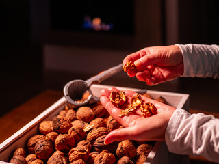 Freshly cracked walnuts over a box of nuts