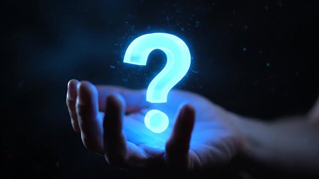 A hand cradles a glowing, azure question mark in a deep black space. Sparks swirl