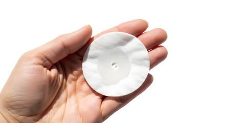 Woman's hand holding a round wet cotton pad used for facial skincare and hygiene. isolated PNG with Transparent Background