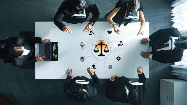 Diverse business team engages in a strategic session using virtual reality to explore legal concepts and innovative solutions, enhancing teamwork and productivity. Trope
