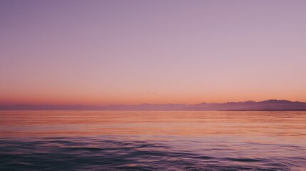 Fototapeta premium Serenity Sunset Over a Glasslike Tranquil Sea Horizon 