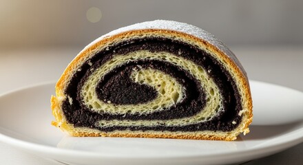 Close-up of a delicious slice of poppy seed roll dusted with powdered sugar on a white plate.