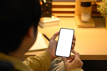 Man hands holding smart phone with blank screen for your text message or information