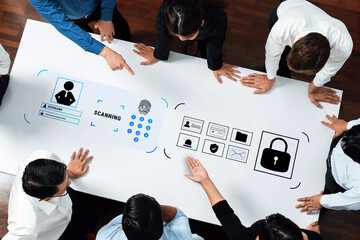 A diverse team discusses biometric scanning techniques in a workplace setting, focusing on strategies for enhancing digital security and data protection methods. Trope
