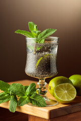 Diet vegan cocktail with chia seeds, lime, and mint.
