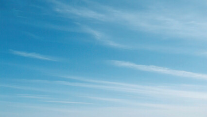 Blue sky with wispy clouds