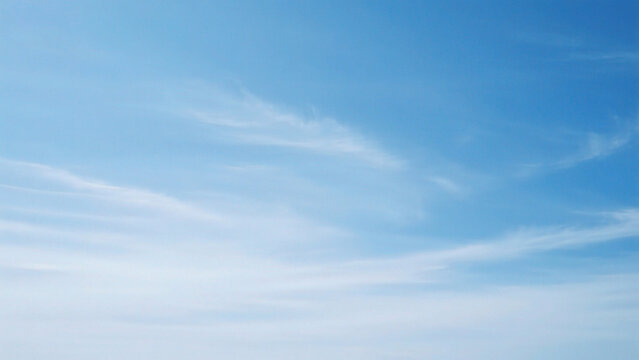 Blue sky with wispy clouds