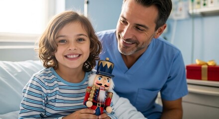 Happy child holding nutcracker toy with adult in hospital room. Christmas present 