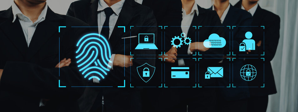 A group of professionals in suits stands confidently against a modern backdrop, highlighting digital security icons that emphasize the importance of cybersecurity in business today. Trope