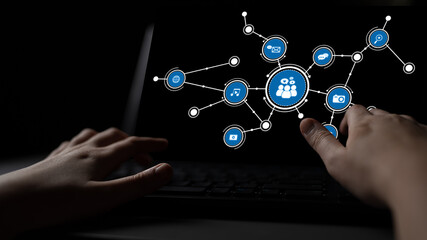 A conceptual image showcasing hands interacting with a laptop screen featuring user icons and social media symbols, highlighting digital communication and connectivity themes. Tessel