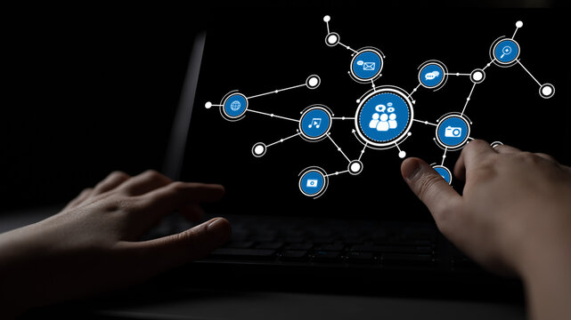 A conceptual image showcasing hands interacting with a laptop screen featuring user icons and social media symbols, highlighting digital communication and connectivity themes. Tessel