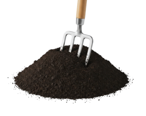 Small metal garden cultivator rests upright in a mound of dark, rich organic material against a solid black background