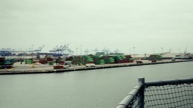 Pan Across Los Angeles Harbor to Commodore Schuyler F. Heim Bridge and US Navy Ship with AA Gun