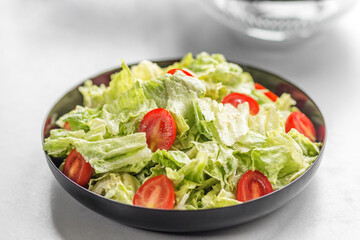 Fresh romaine lettuce salad with cherry tomatoes