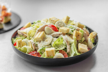 Classic Caesar salad with chicken, eggs and croutons