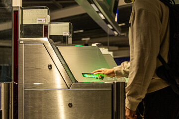 A man scanning boarding pass on smartphone at airport gate