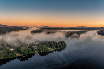 Frymburk on the shore of the Lipno dam at sunset from above