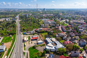 Aerial panorama of Krakow, Poland, showing the Podgórze district. View of the major Nowohucka road intersecting dense urban allotment gardens and residential areas.