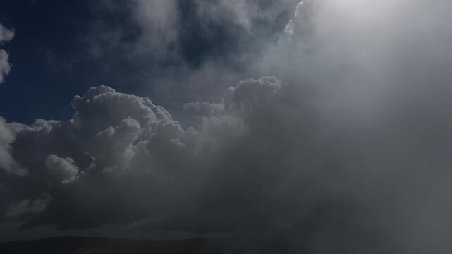 Reveal from inside the clouds to the blue sky