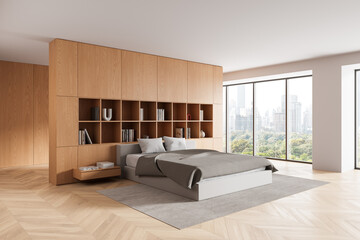 Modern bedroom interior with wooden wall storage, minimalist furniture, and panoramic city view through floor-to-ceiling windows. 3D Rendering