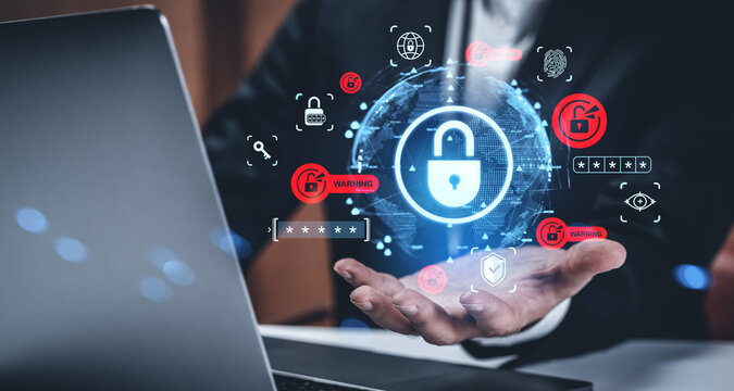 Cybersecurity data protection concept with glowing padlock icons over businessman's hands and laptop on a dark creative background in office setting.