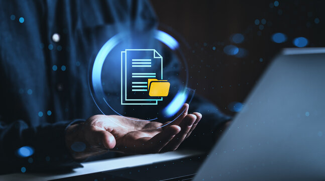 Digital document icon with folder floating over hands in futuristic interface concept on dark background with glowing blue elements and creative display.
