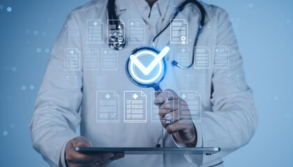 Doctor verifying digital medical records with magnifying glass and checkmark icon on futuristic healthcare interface on blue background in creative concept.