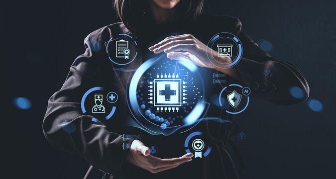 Woman holding digital healthcare interface with futuristic icons