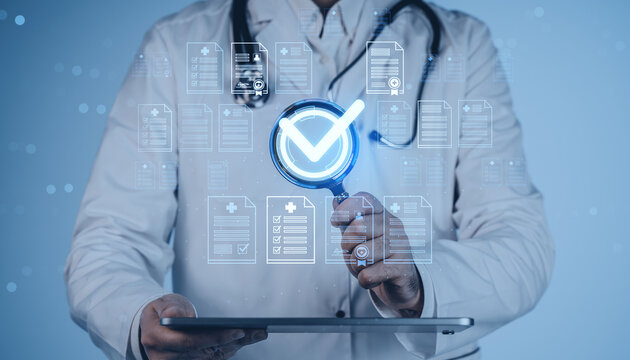 Doctor verifying digital medical records with magnifying glass and checkmark icon on futuristic healthcare interface on blue background in creative concept.