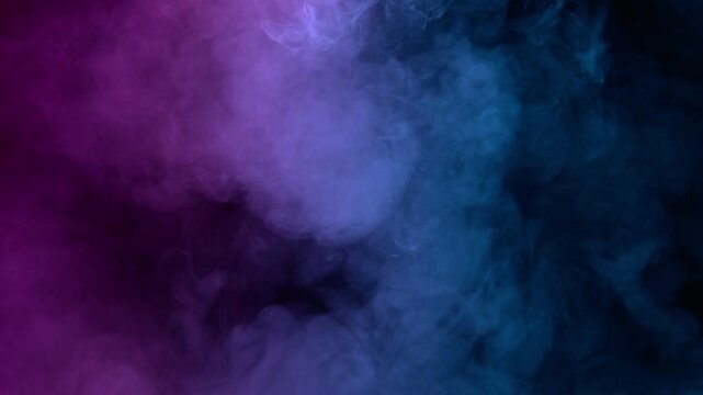 Super Slow Motion Shot of Atmospheric Smoke in Neon Colors Slowly Floating on Black Background at 1000fps