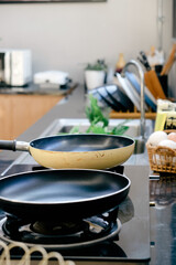 Frying pan on the stove in a modern kitchen. 