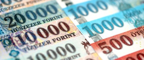 Hungarian Forints currency money bills in big amount. Many HUF currency banknotes with different...